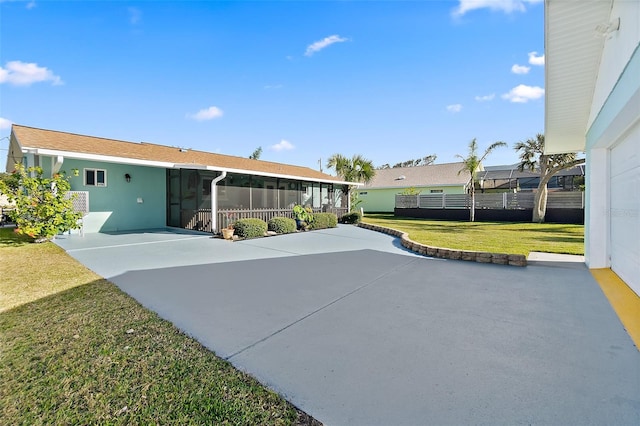 exterior space with a lanai, a yard, and a patio area