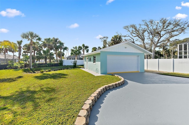 view of property exterior with a yard and a garage