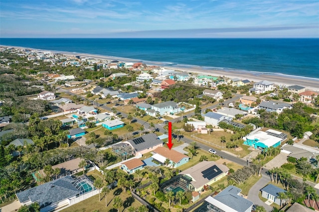 bird's eye view featuring a beach view and a water view