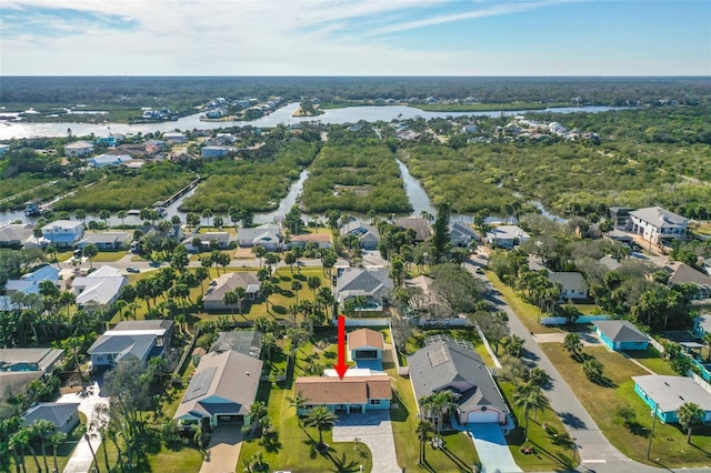 bird's eye view with a residential view, a water view, and a forest view