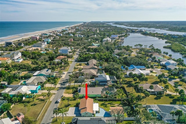 aerial view featuring a water view and a beach view