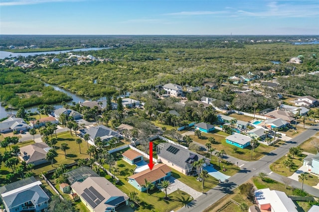 bird's eye view featuring a residential view, a water view, and a view of trees