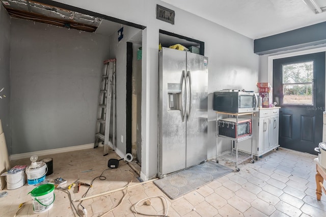 kitchen featuring stainless steel appliances and tile patterned floors