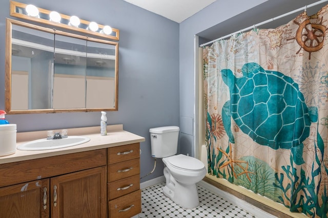 bathroom with vanity, toilet, baseboards, a shower with shower curtain, and tile patterned floors