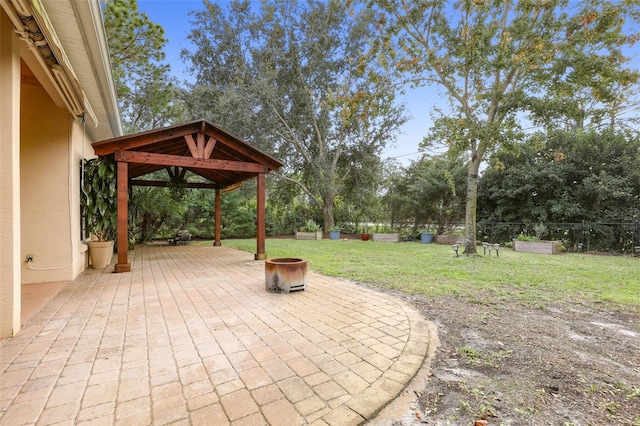 view of patio with a fenced backyard and a gazebo