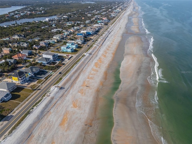 aerial view with a view of the beach and a water view