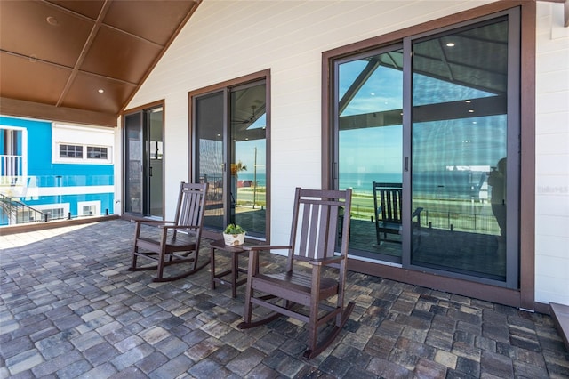 view of patio featuring a balcony