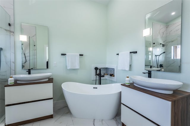 bathroom with vanity and shower with separate bathtub