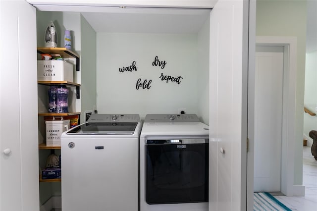 washroom with washer and clothes dryer