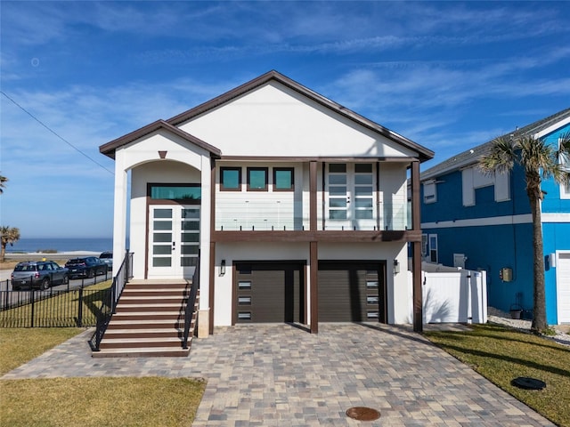 view of front of property featuring a garage and a front lawn