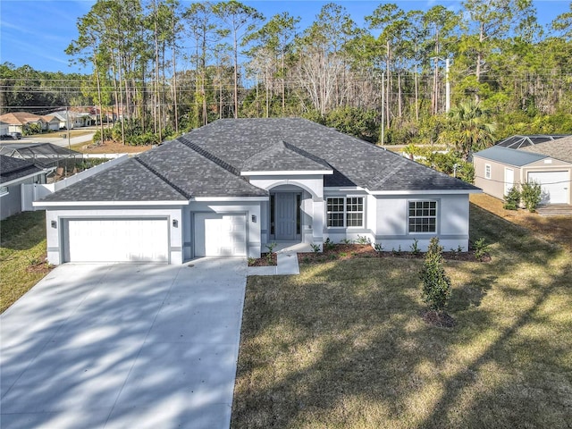 ranch-style house featuring a garage and a front yard