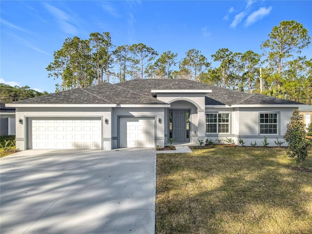 ranch-style home featuring a garage and a front lawn