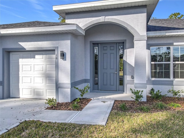 doorway to property featuring a garage