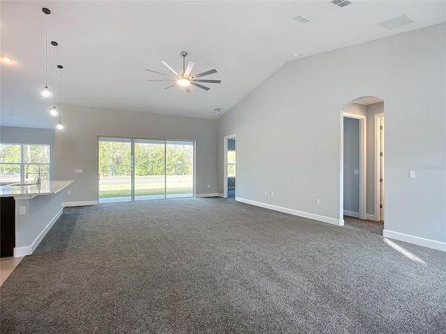 spare room with sink, plenty of natural light, ceiling fan, and carpet flooring