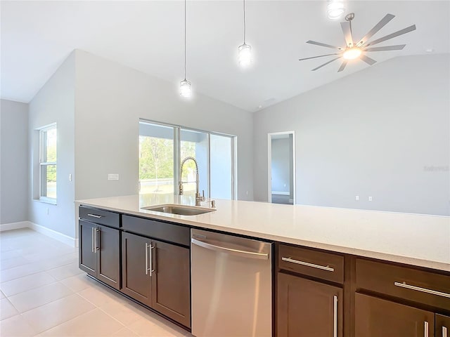 kitchen with lofted ceiling, sink, a healthy amount of sunlight, decorative light fixtures, and stainless steel dishwasher