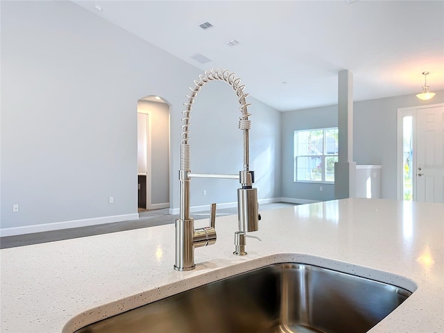 interior details with sink and light stone counters