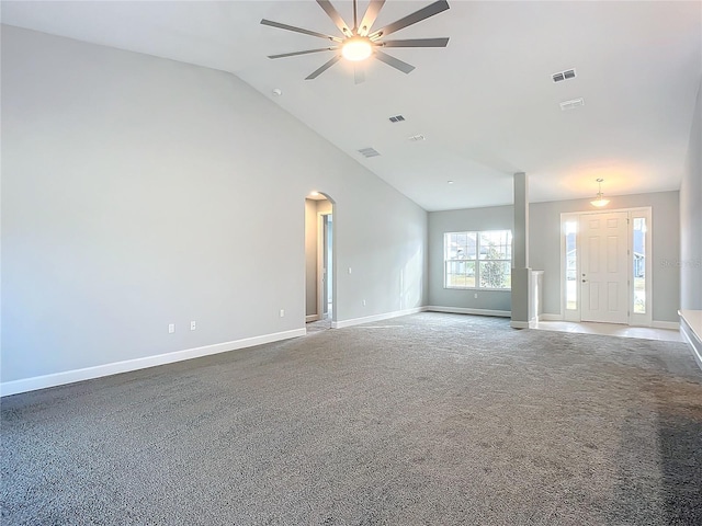 unfurnished living room with high vaulted ceiling, ceiling fan, and carpet flooring