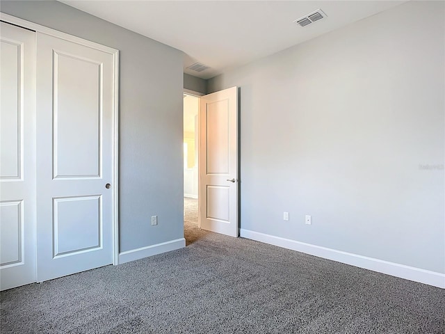 unfurnished bedroom featuring carpet flooring