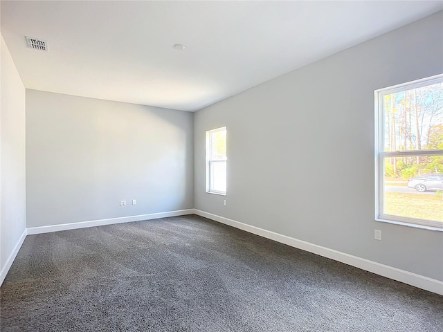 empty room with carpet flooring