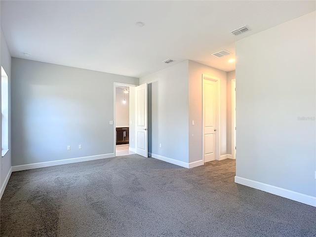 spare room with carpet floors