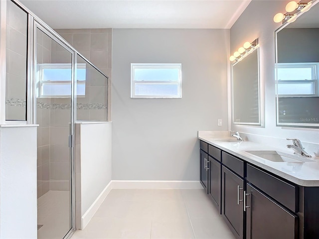 bathroom with vanity, an enclosed shower, and tile patterned flooring