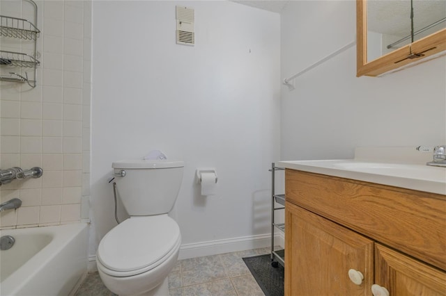 full bathroom featuring vanity, tiled shower / bath, tile patterned flooring, and toilet