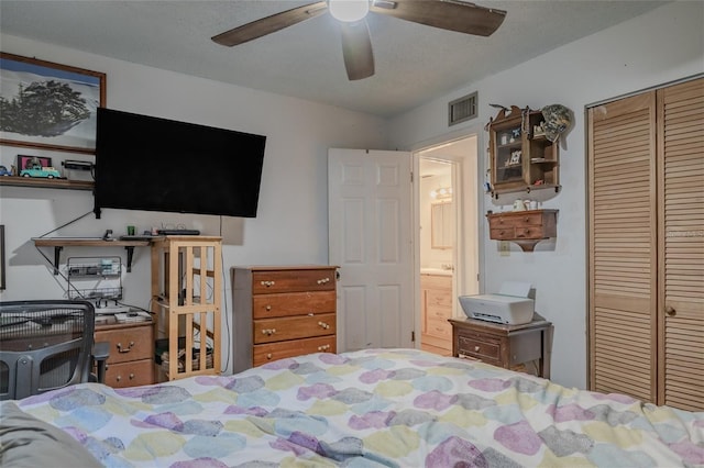 bedroom with a textured ceiling, a closet, and ceiling fan