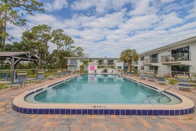 view of swimming pool with a patio and a gazebo