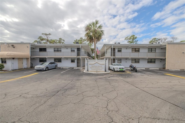 view of property with uncovered parking