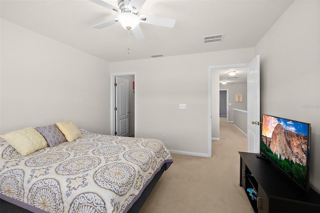 bedroom featuring light colored carpet and ceiling fan