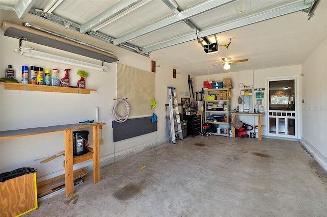 garage featuring a garage door opener and a workshop area