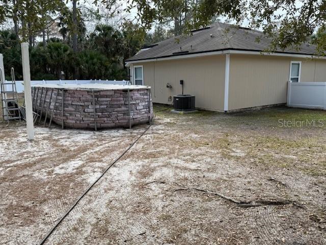 view of yard featuring central AC unit