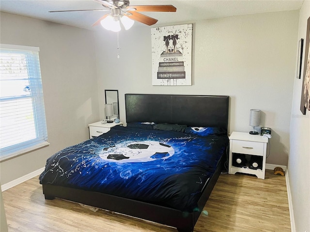 bedroom featuring ceiling fan and hardwood / wood-style floors