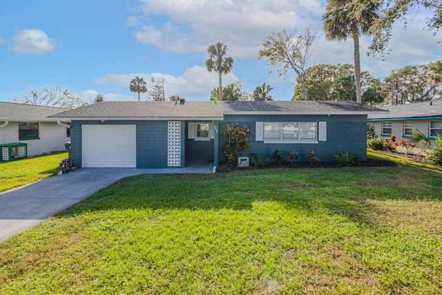 ranch-style home featuring a garage and a front lawn