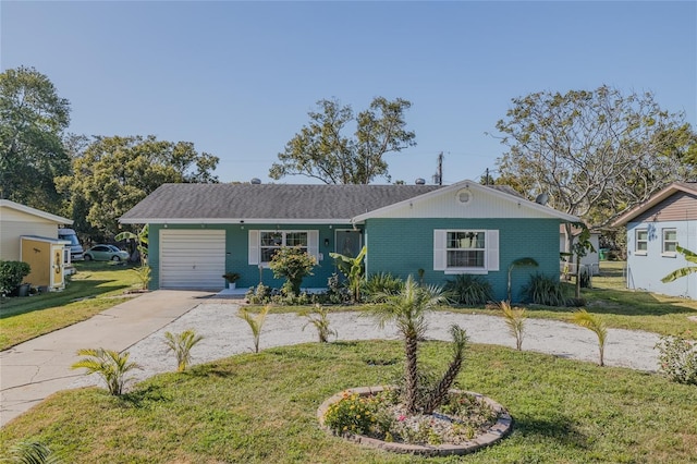 ranch-style house with a garage and a front lawn