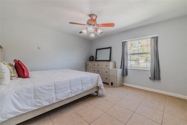 bedroom featuring light tile patterned floors and ceiling fan