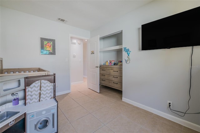 bedroom featuring light tile patterned flooring