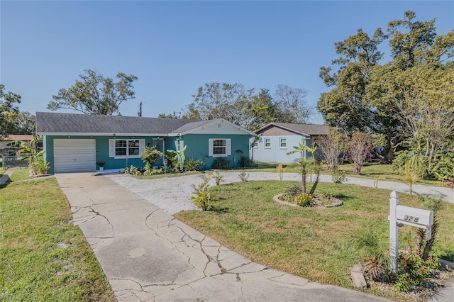 ranch-style house with a garage and a front lawn