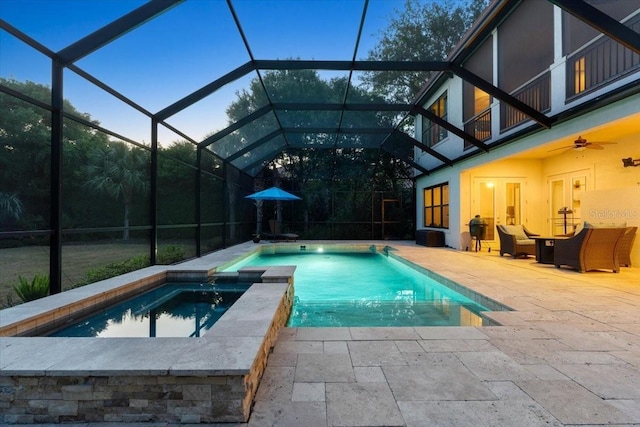 view of swimming pool with ceiling fan, an outdoor living space, a lanai, and a patio