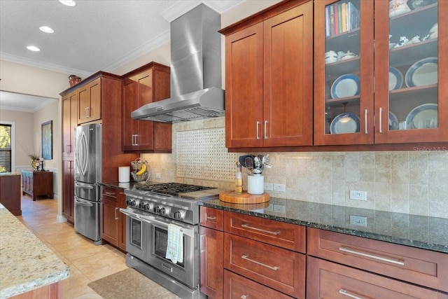 kitchen with ventilation hood, tasteful backsplash, dark stone countertops, ornamental molding, and stainless steel appliances