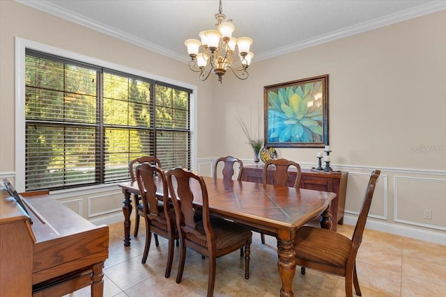 tiled dining space featuring crown molding and an inviting chandelier