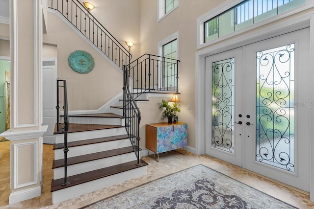 entryway with a towering ceiling