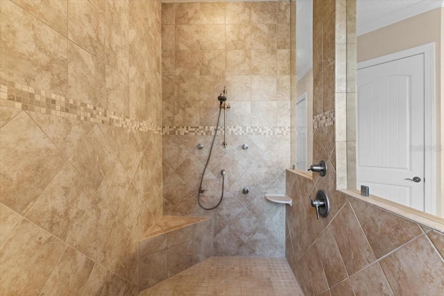 bathroom featuring a tile shower