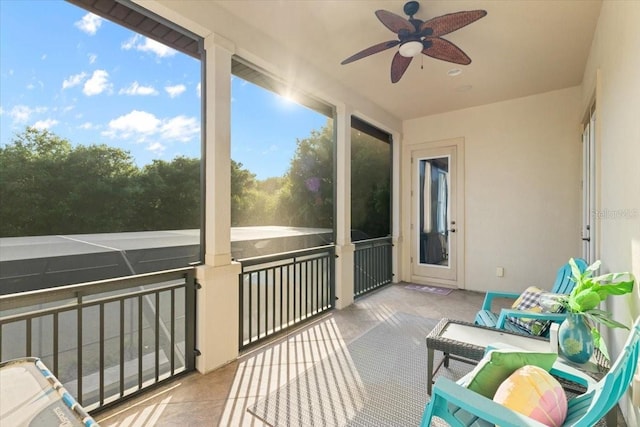 sunroom with plenty of natural light and ceiling fan