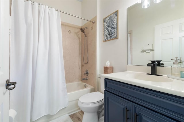 full bathroom featuring vanity, toilet, and shower / tub combo