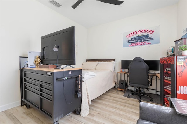 bedroom with ceiling fan and light hardwood / wood-style floors