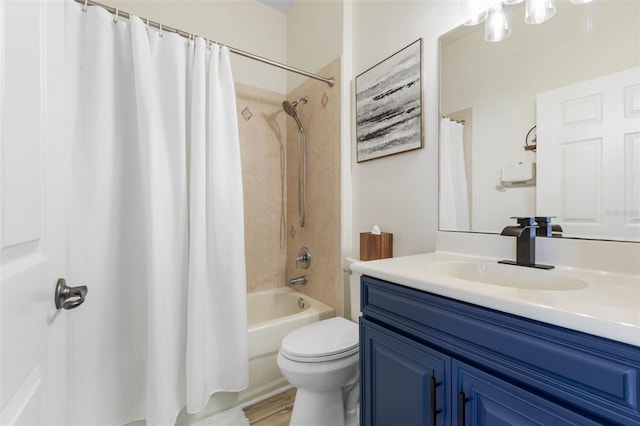 full bathroom with vanity, toilet, and shower / tub combo