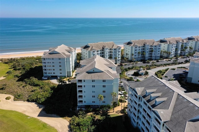 birds eye view of property featuring a view of the beach and a water view