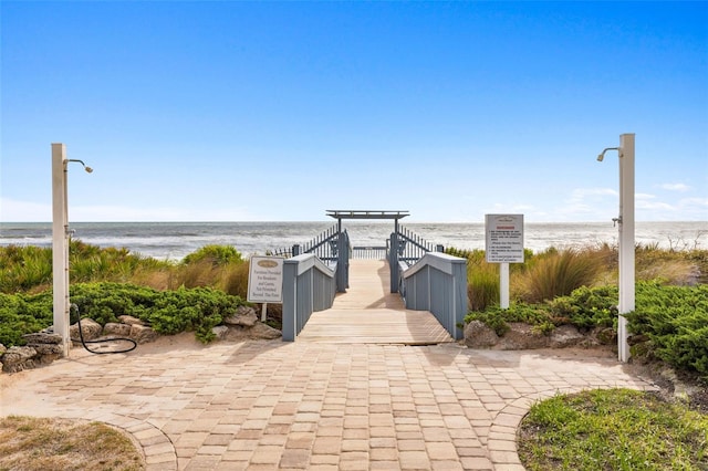 view of home's community with a view of the beach and a water view