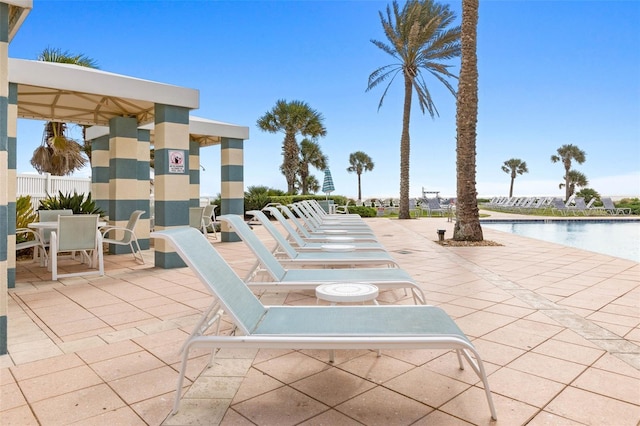 view of patio / terrace featuring a community pool